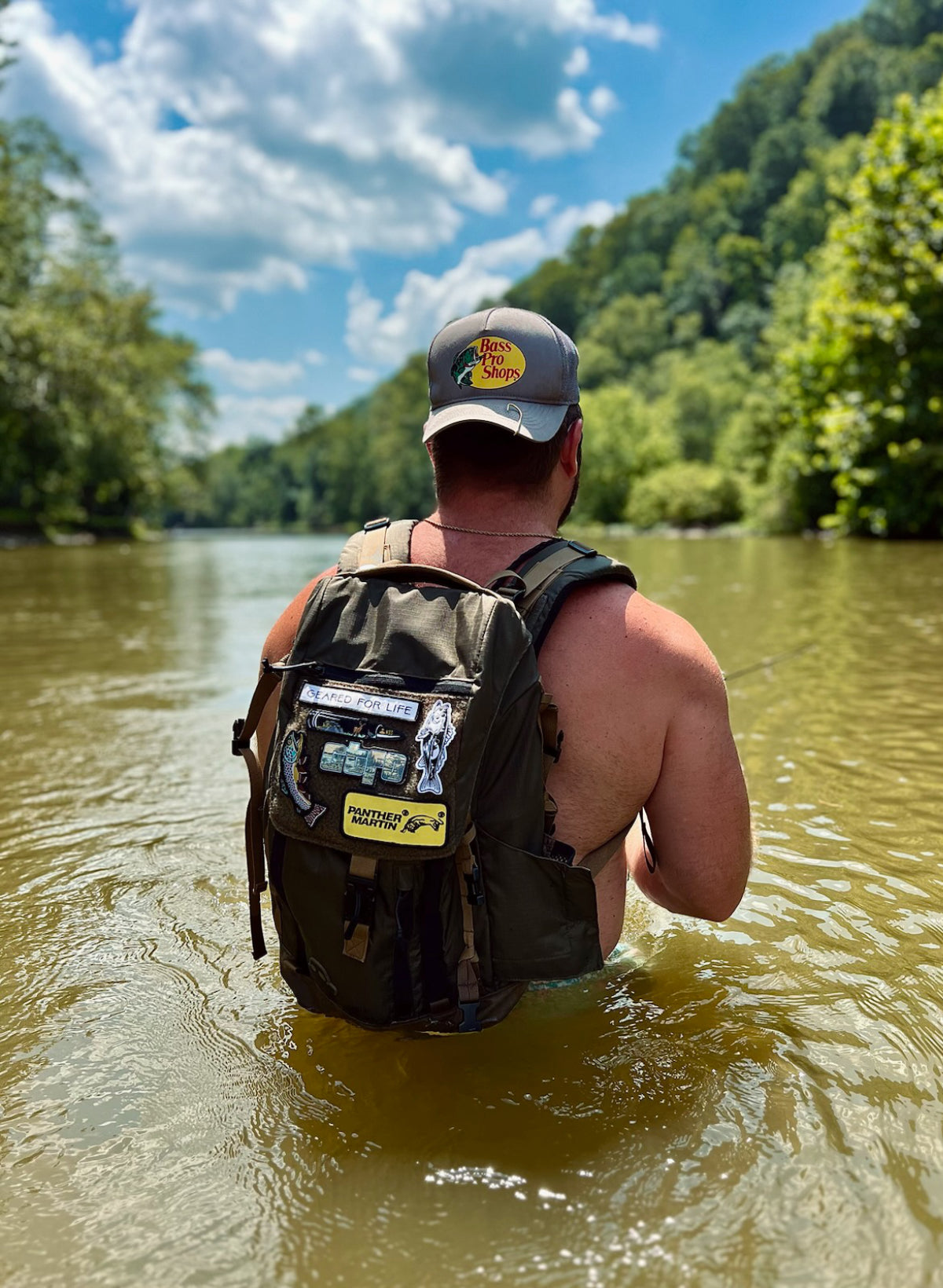 A man fishing with NSG fishing backpack