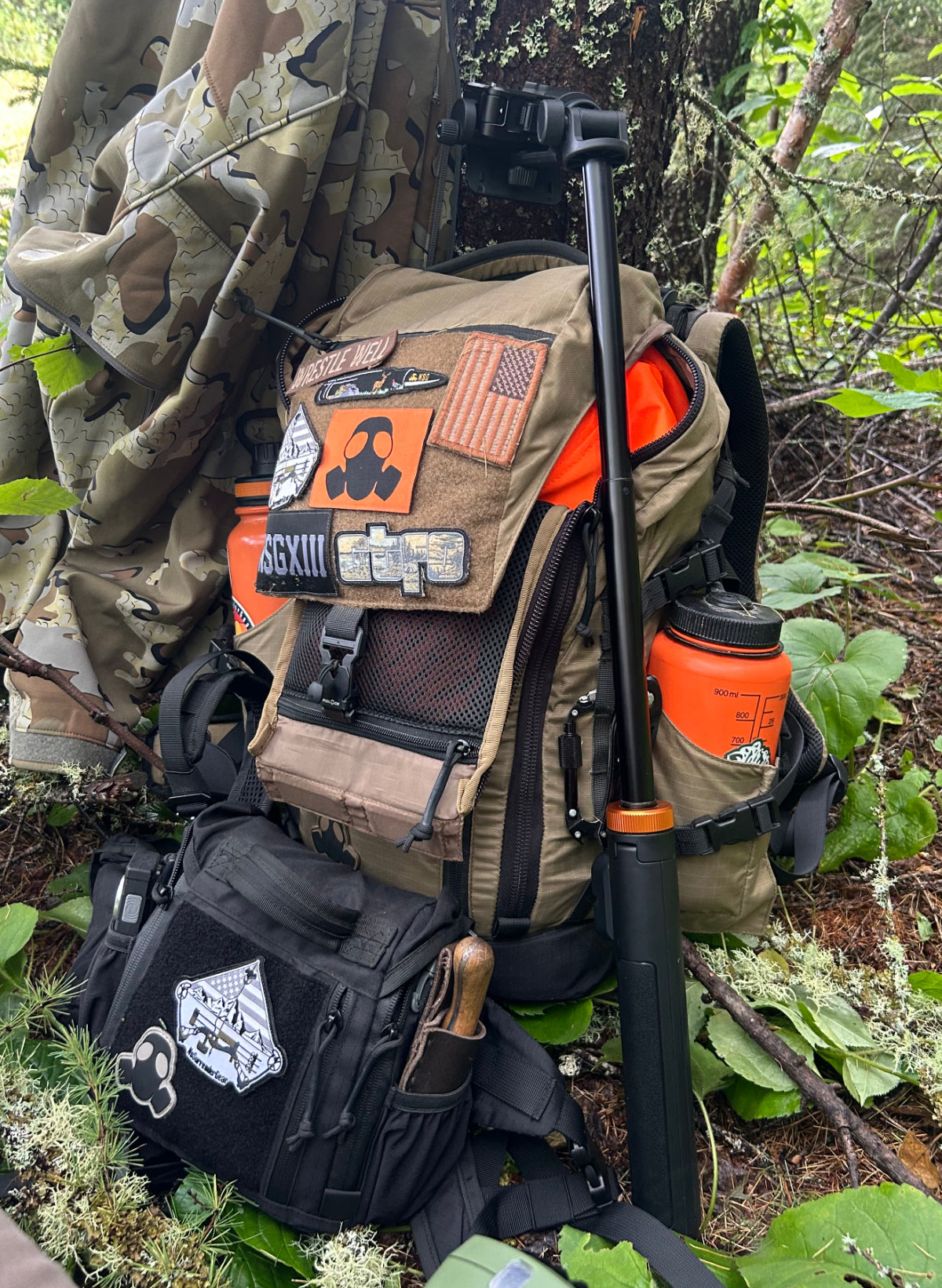 NSG Backpack with various patches and items in a forest setting