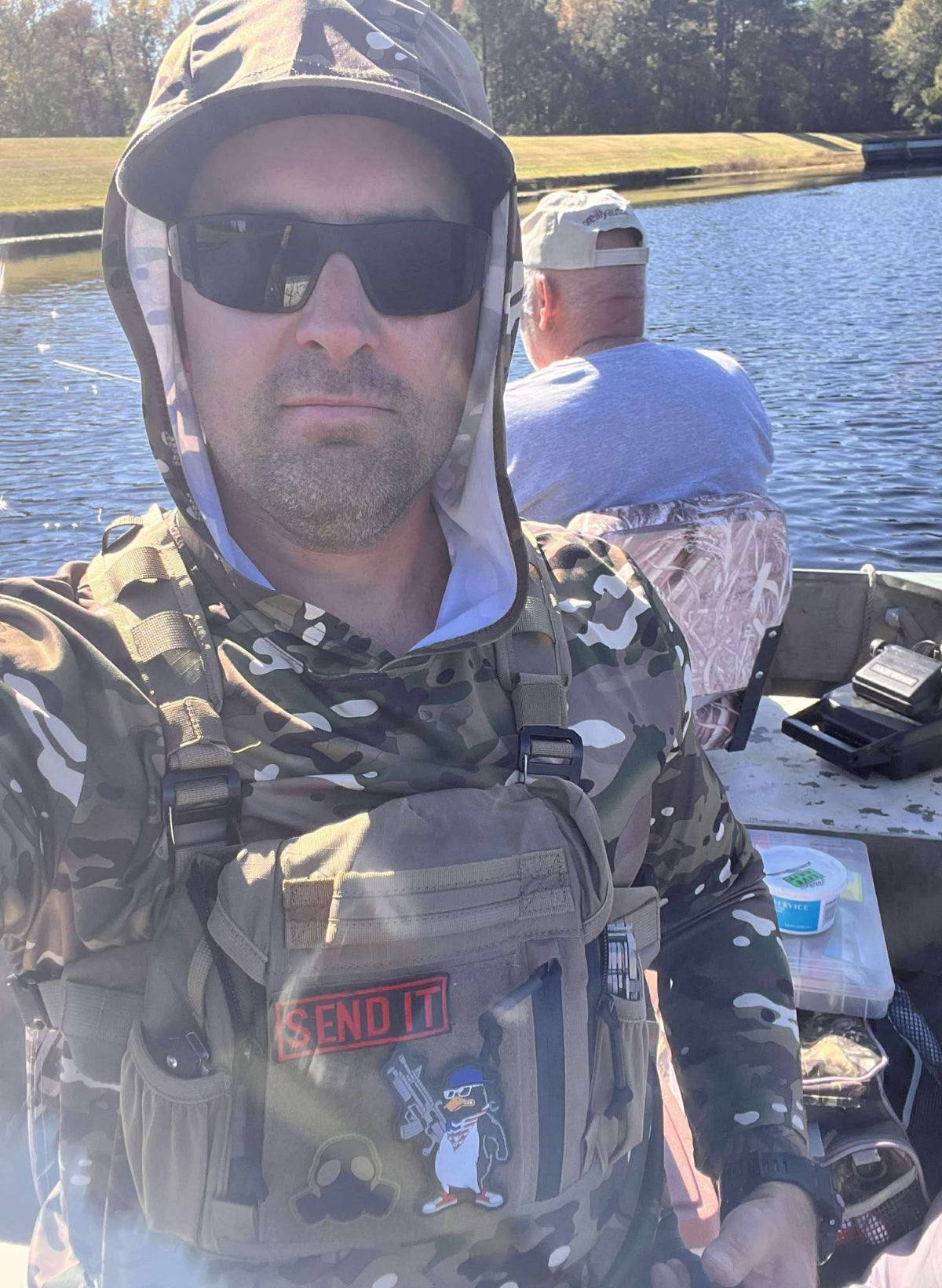 Two men with fishing chest pack