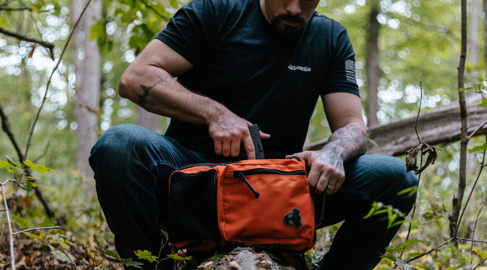 A man putting something into his scout pack